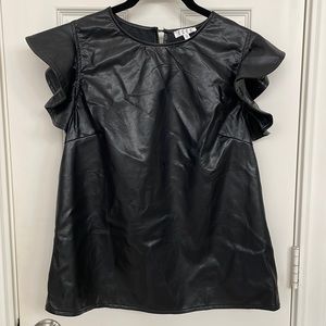 Black leather top, ruffled sleeves. perfect condition. Small top button closure.
